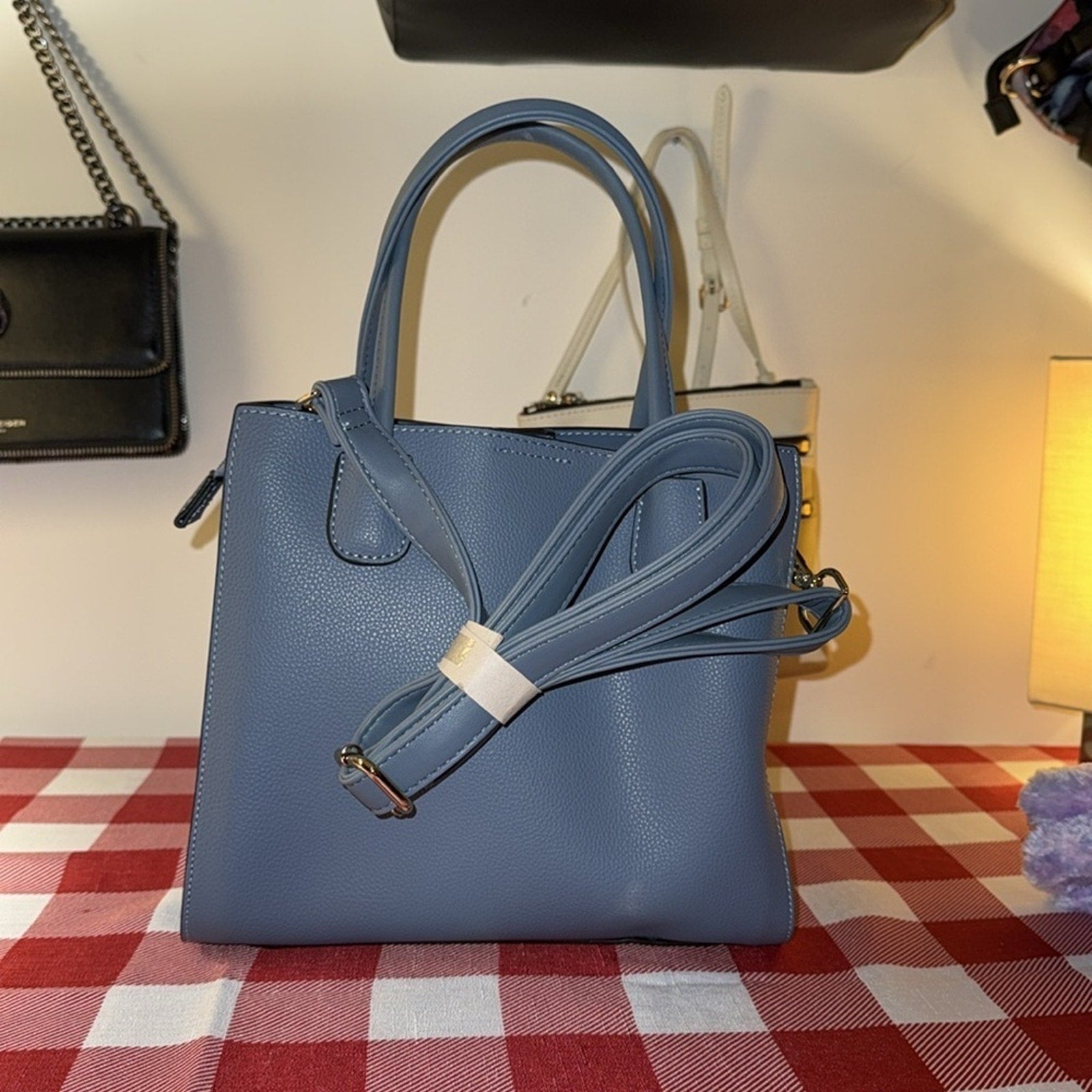 A stylish Sky Blue handbag Unknown brand with a snap gold closure NWOT