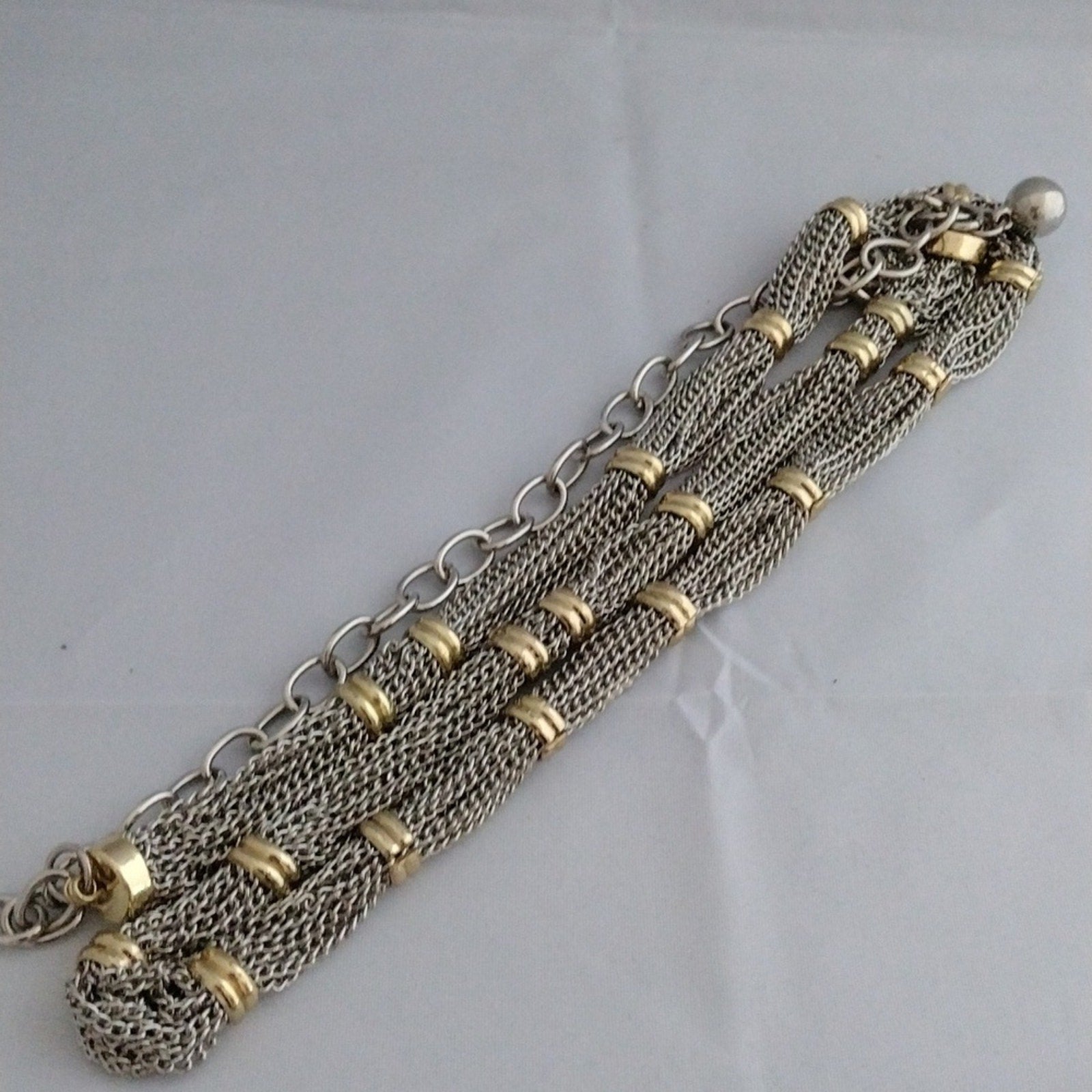 Silver tone chain with goldtone accents