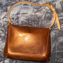 LOUIS VUITTON
Bronze Monogram Vernis Thompson Street Bag
