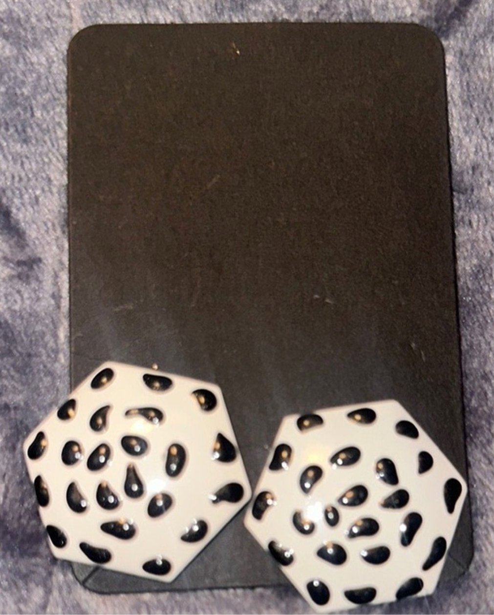 White earrings with black overlay