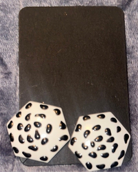 White earrings with black overlay