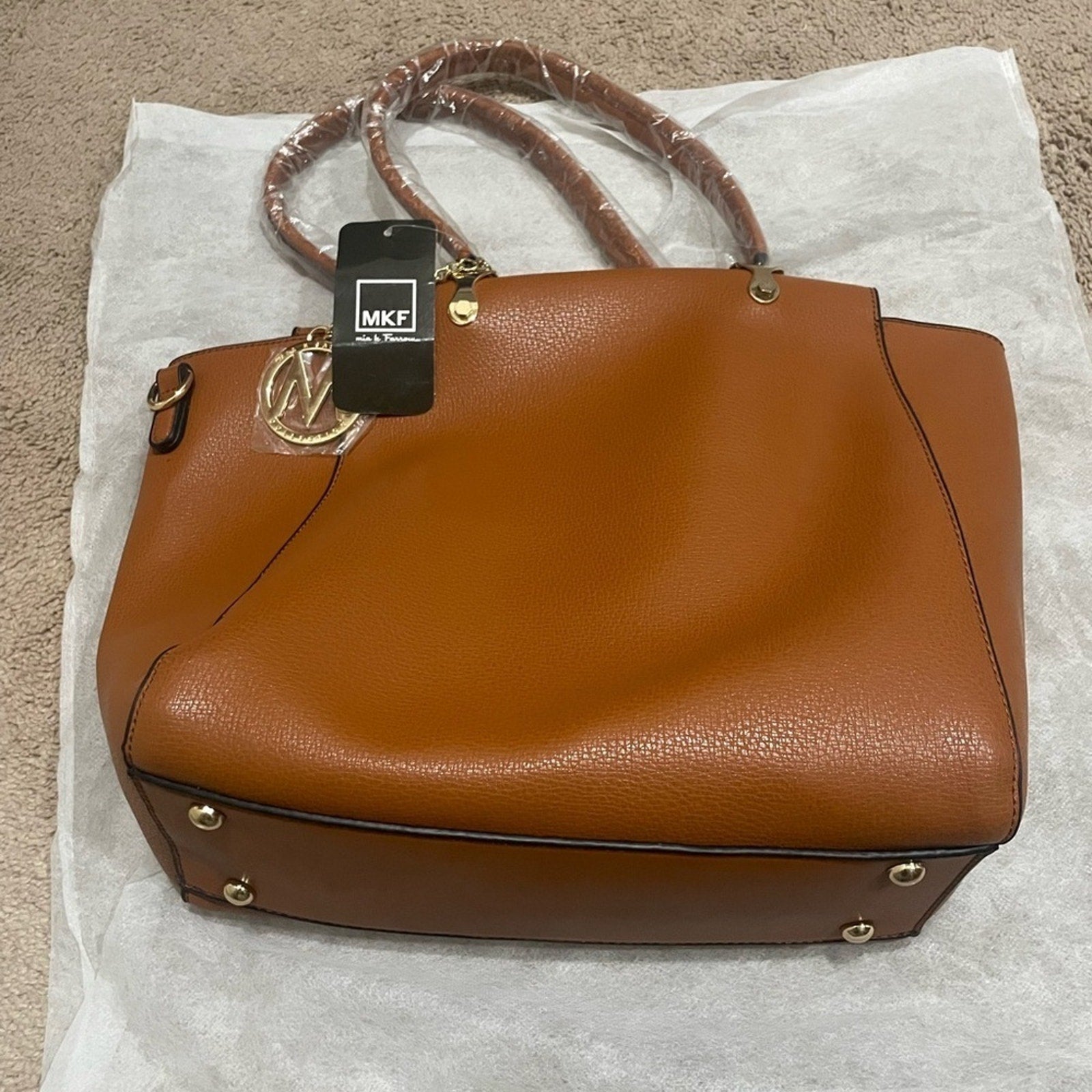 Mia K Farrow shoulder bag with gold collection piece