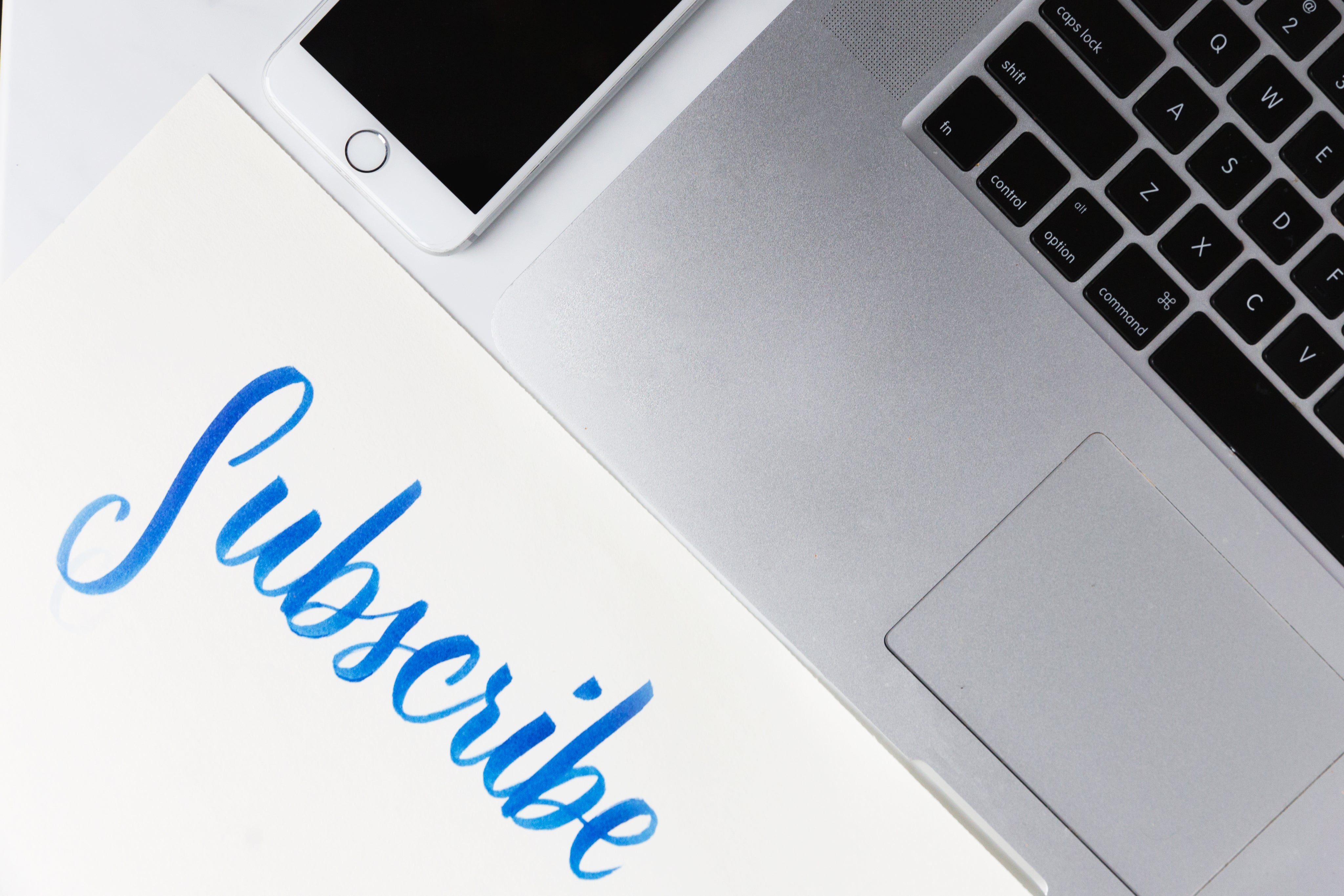 office-desk-with-piece-of-paper-urging-you-to-subscribe.jpg